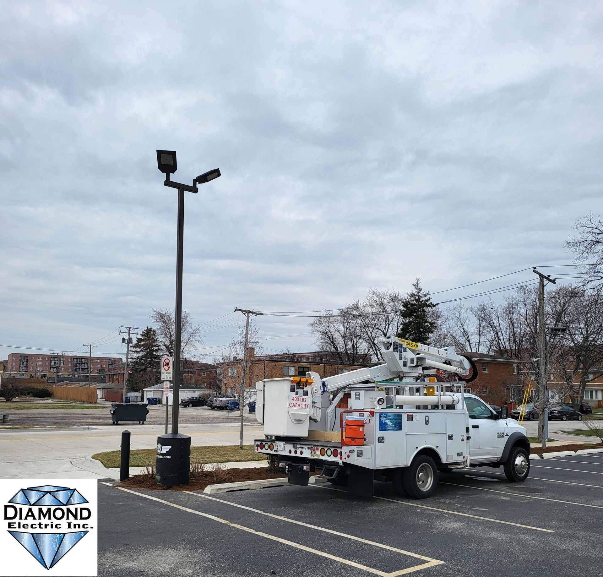 A diamond utility truck is parked in a parking lot