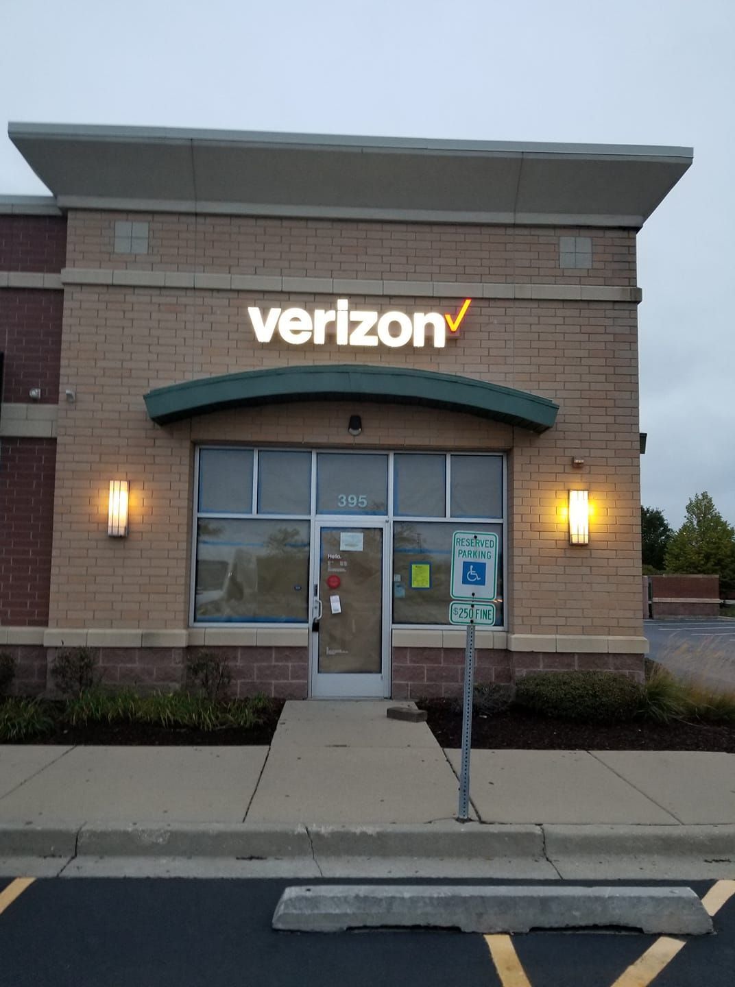 A verizon store is lit up at night