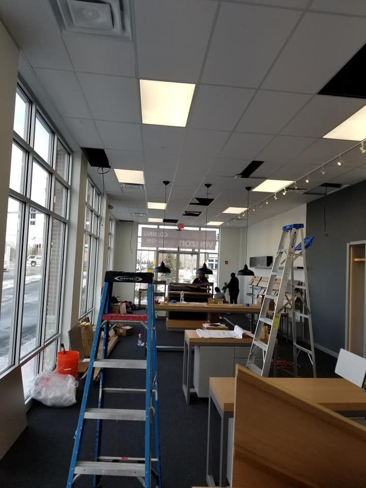 A large room with a ladder in the middle of it