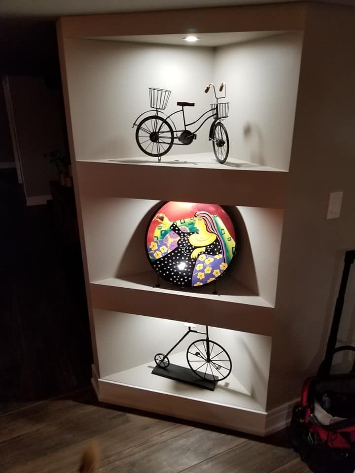A shelf with a bicycle and a plate on it