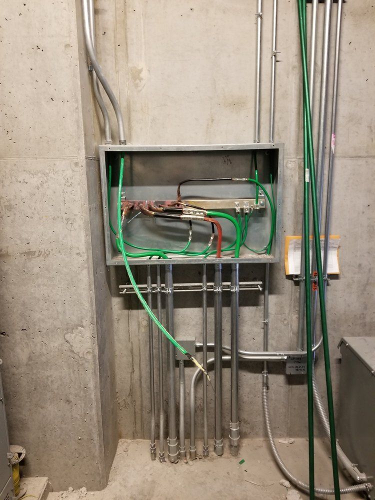 A box with electrical wires coming out of it.