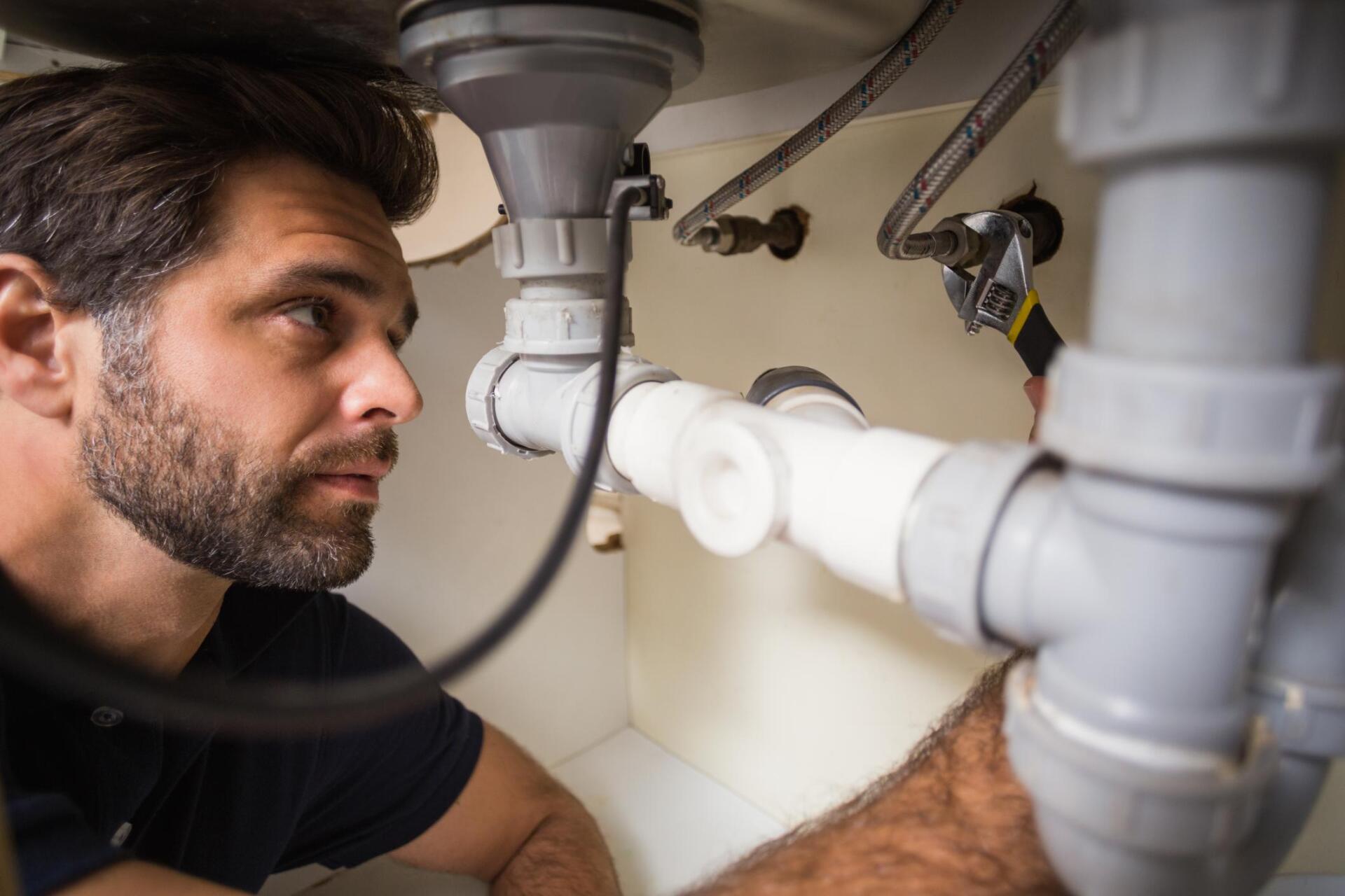 man checking the water pipes