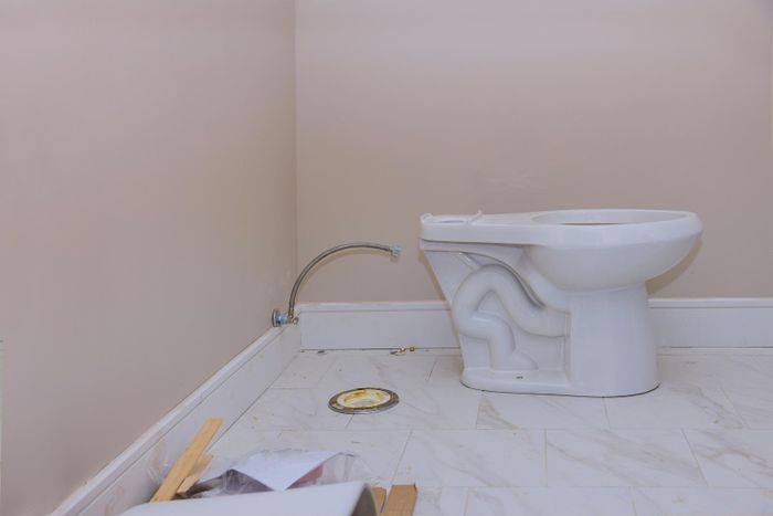 under install toilet bowl