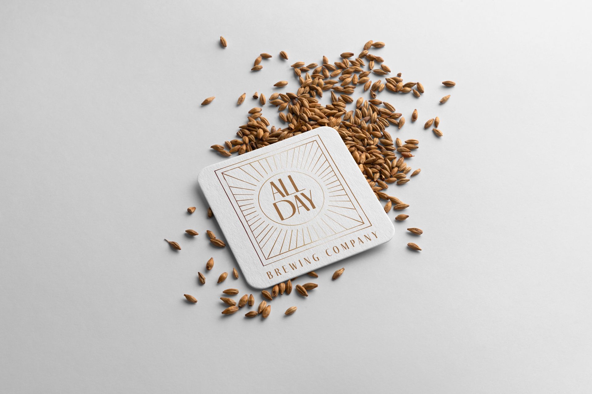 A business card is sitting on top of a pile of grains.