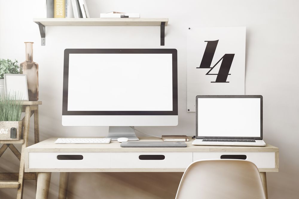 A Desk With a Computer and a Laptop on It — Coastal Computing Solutions in Taree, NSW