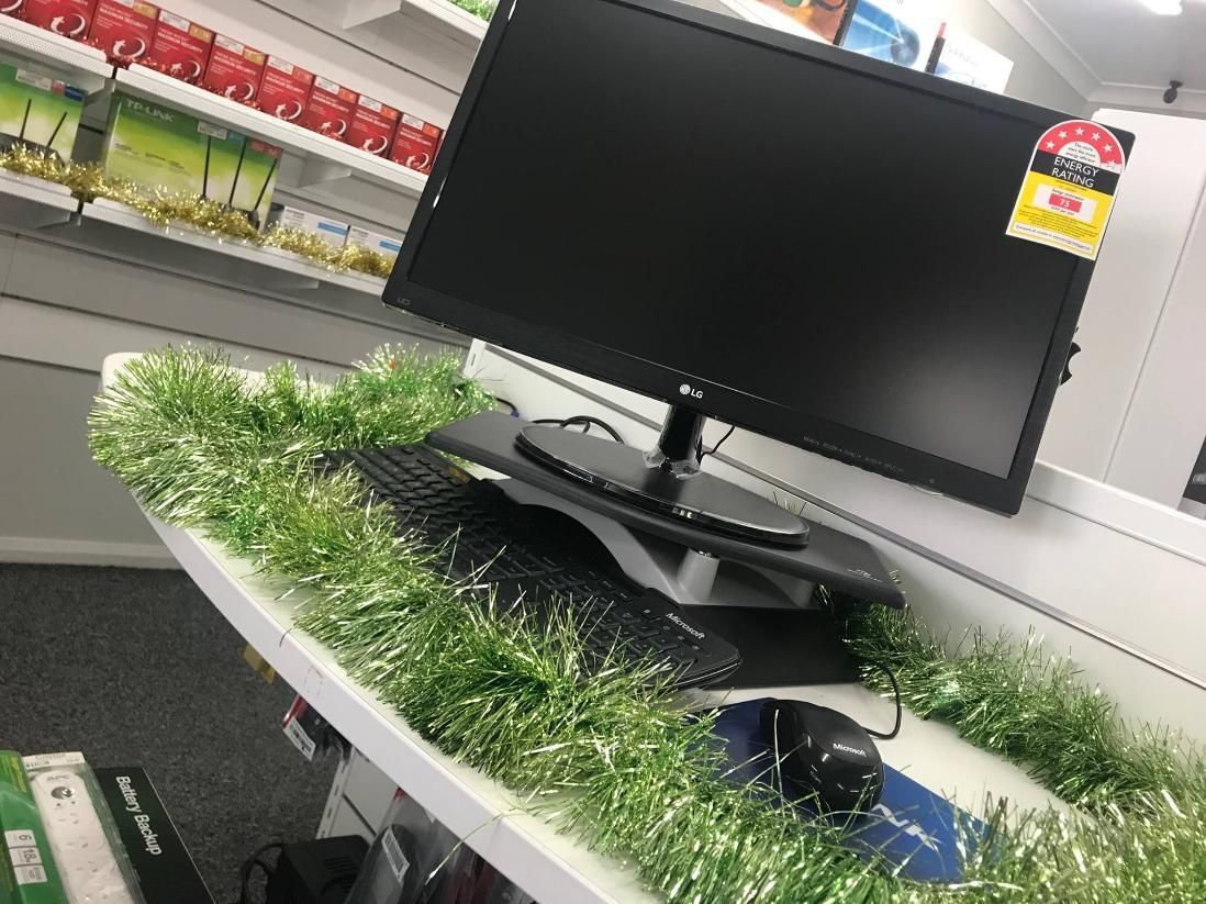 A Computer Monitor is Sitting on Top of a Desk Covered in Grass — Coastal Computing Solutions in Tuncurry, NSW