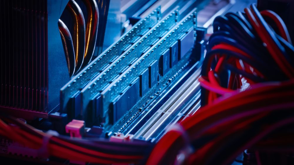 A Close Up of a Computer Motherboard With a Bunch of Wires Coming Out of It — Coastal Computing Solutions in Taree, NSW