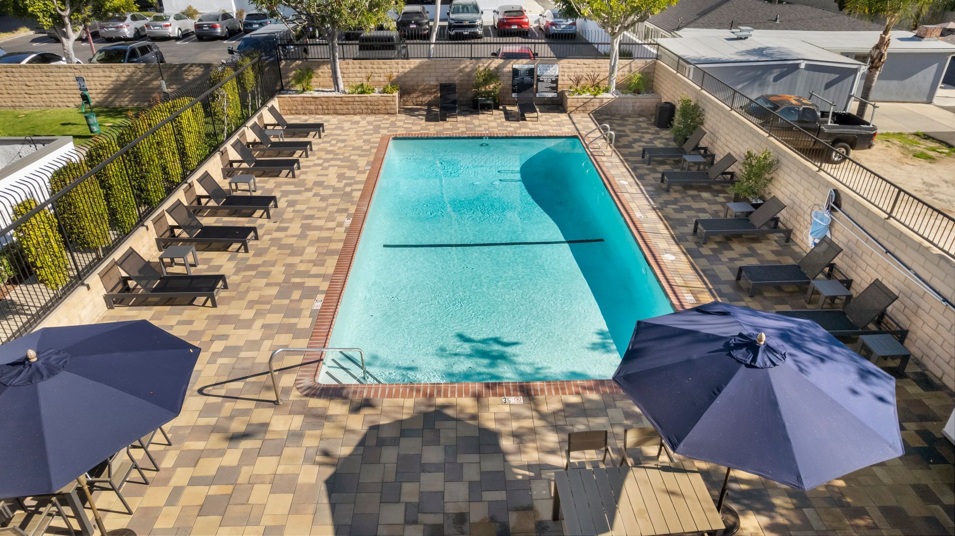overhead of pool, chairs, and umbrella