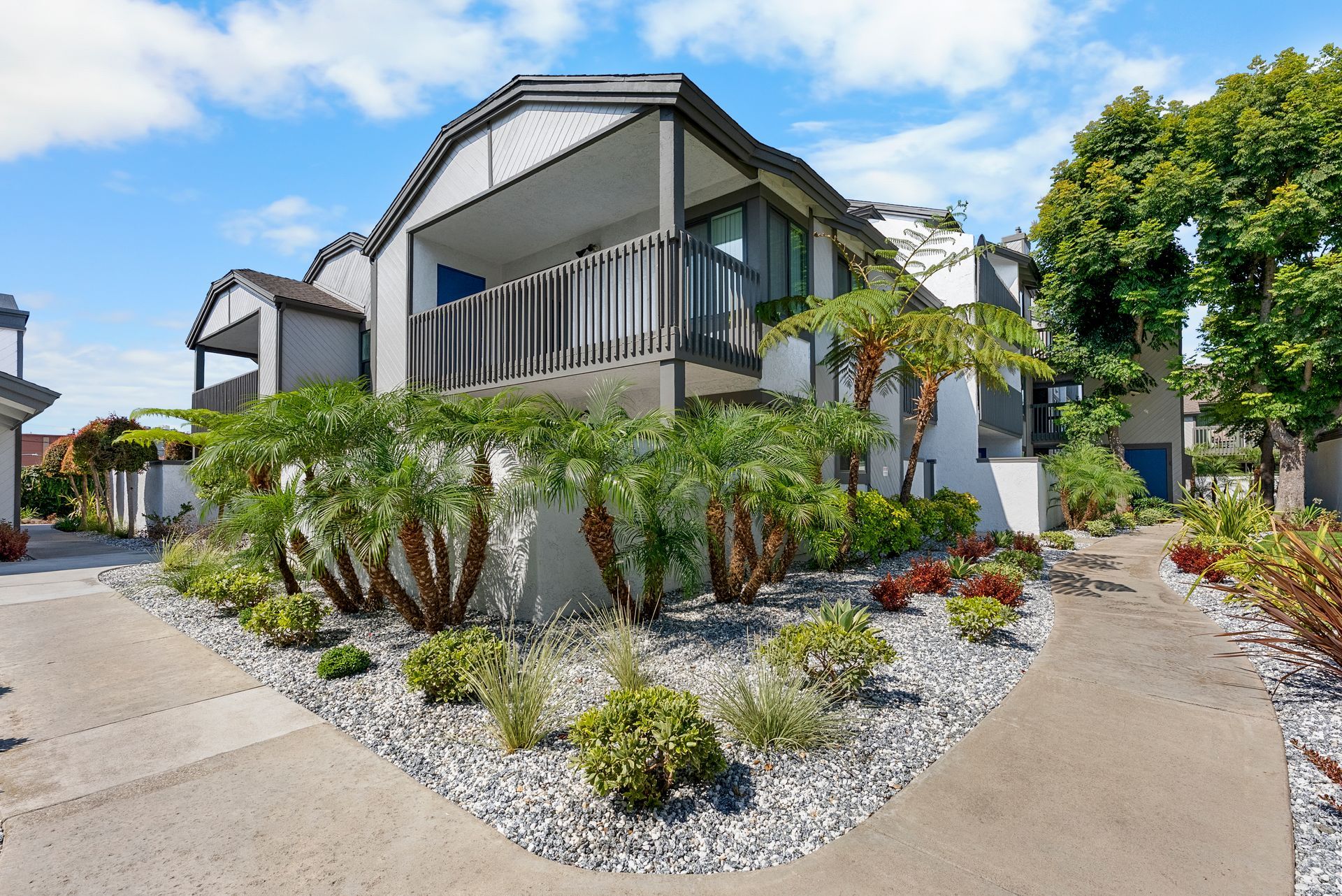 Building exterior with patio and landscaping