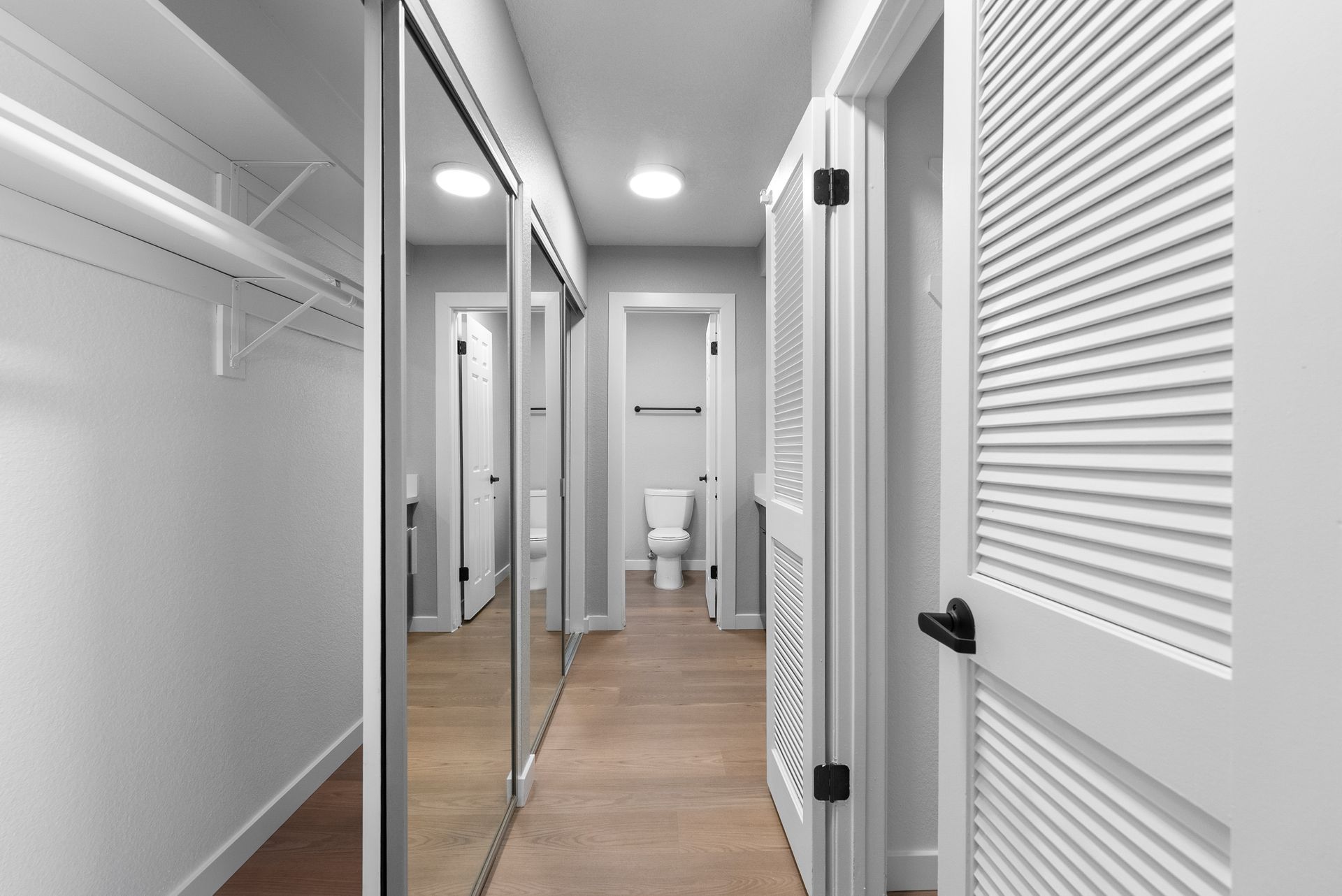 Closet, hallway, and bathroom