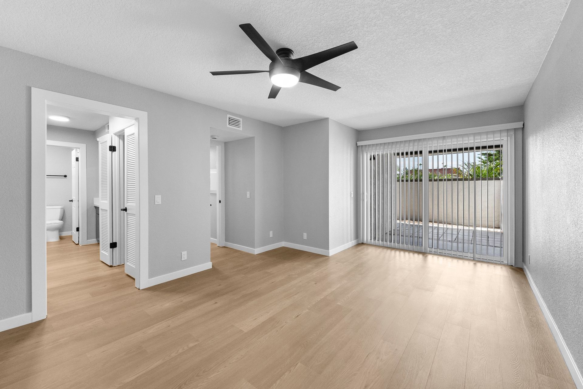 bedroom and sliding door to patio