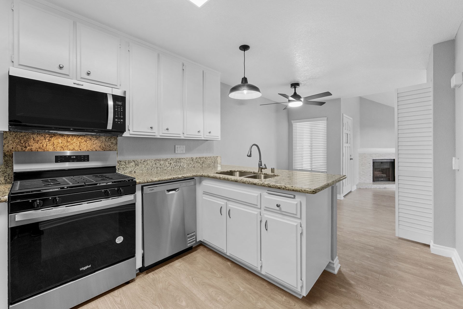 kitchen with oven, dishwasher, microwave, and sink