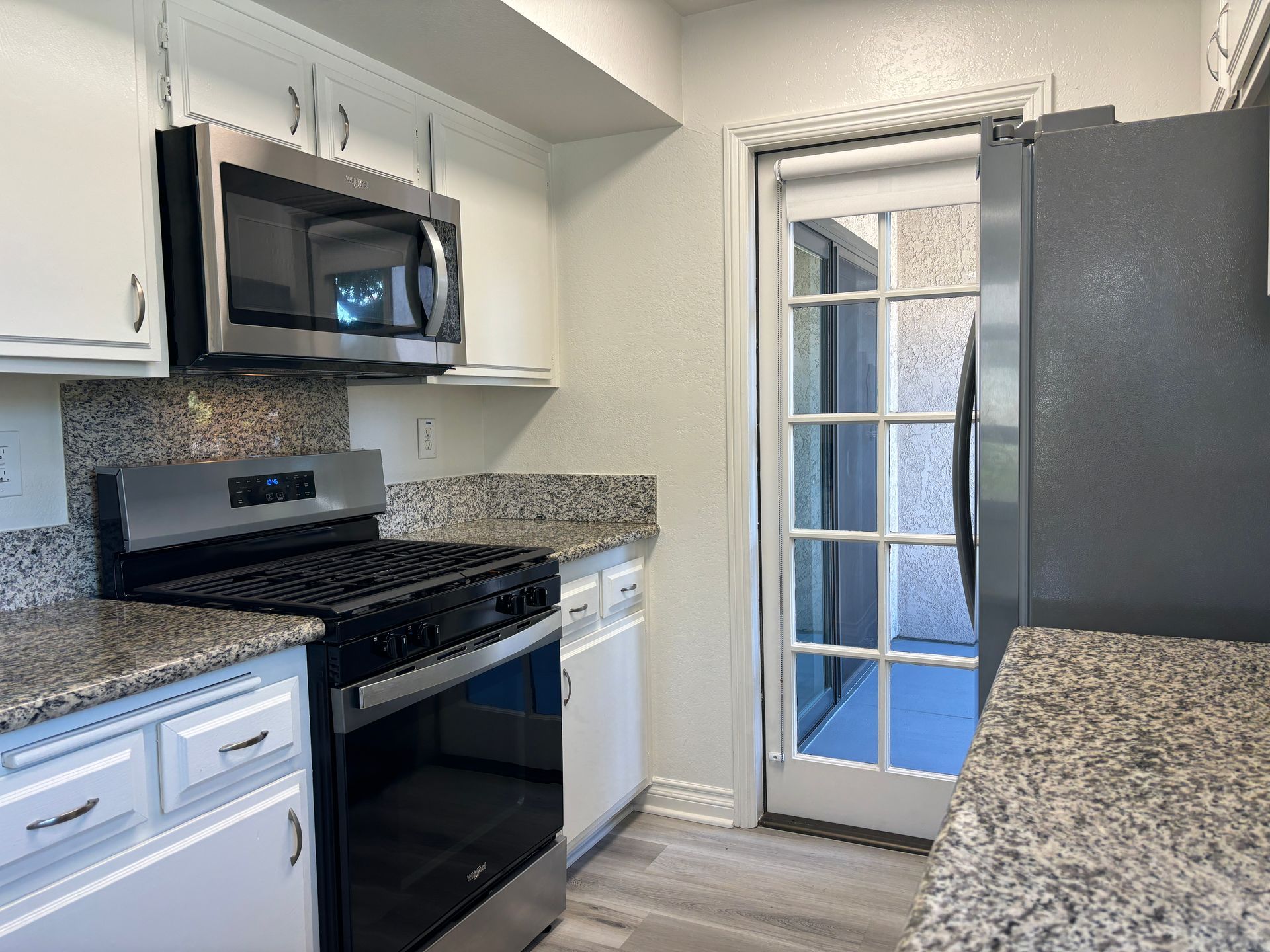 Kitchen with stove and microwave