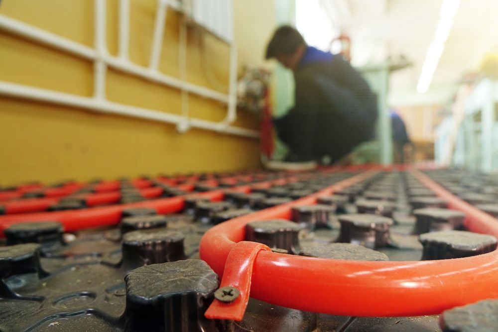 Red Pipes of A Radiant Floor Heating System Being Installed — Illawarra Underfloor Heating In Bellambi, NSW