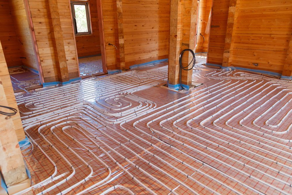 Wavy Pipes on Wooden Floor for Radiant Heating System — Illawarra Underfloor Heating In Shellharbour, NSW