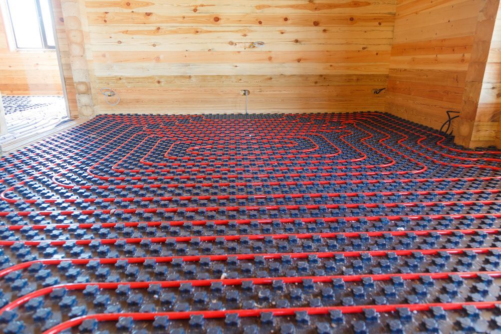 Red Radiant Floor Heating Tubes Installed Across a Room — Illawarra Underfloor Heating In Wollongong, NSW