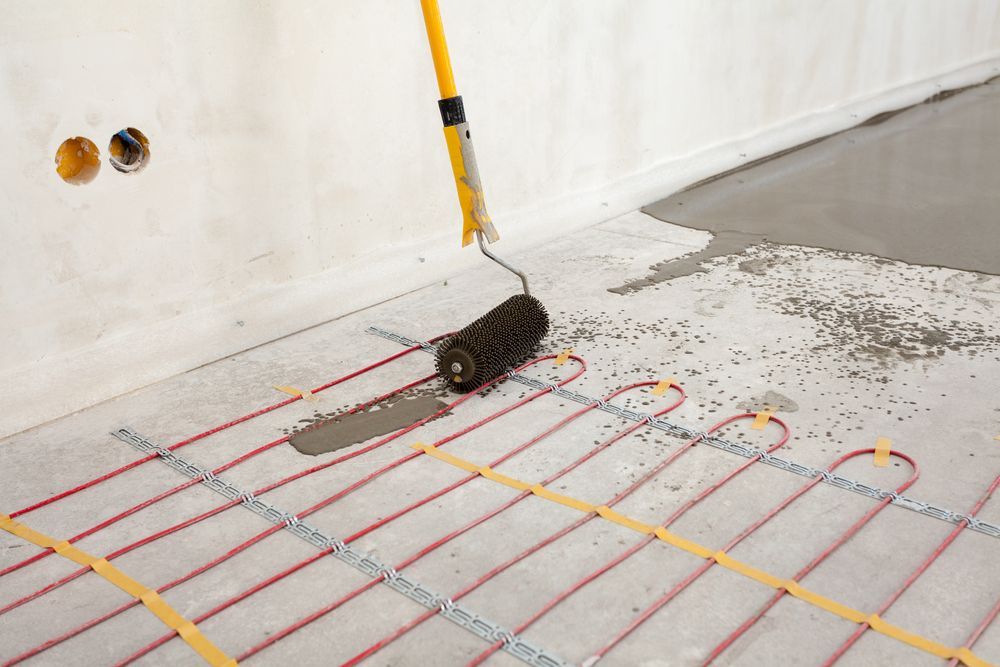 Concrete Floor Being Poured with Heating Pipes Visible — Illawarra Underfloor Heating In Shellharbour, NSW