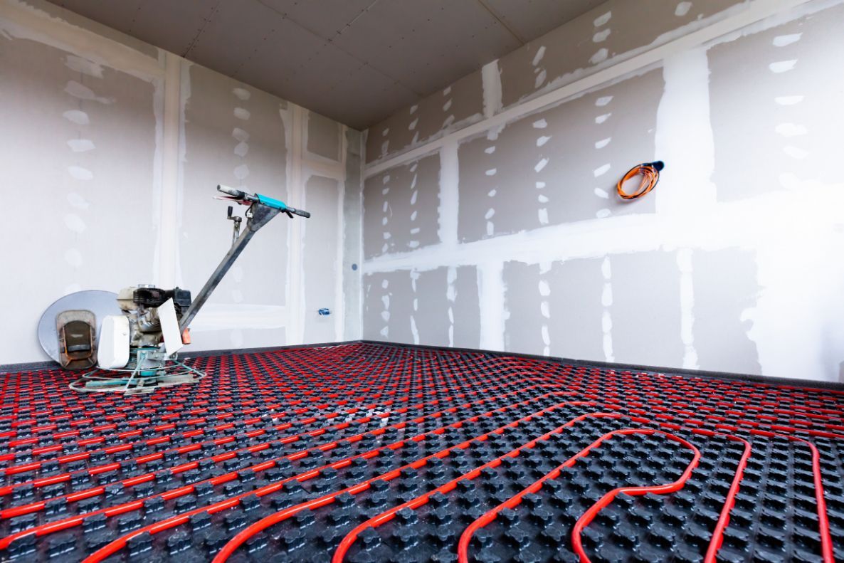 Red Radiant Floor Heating Tubes Installed on A Black Grid — Illawarra Underfloor Heating In Nowra, NSW