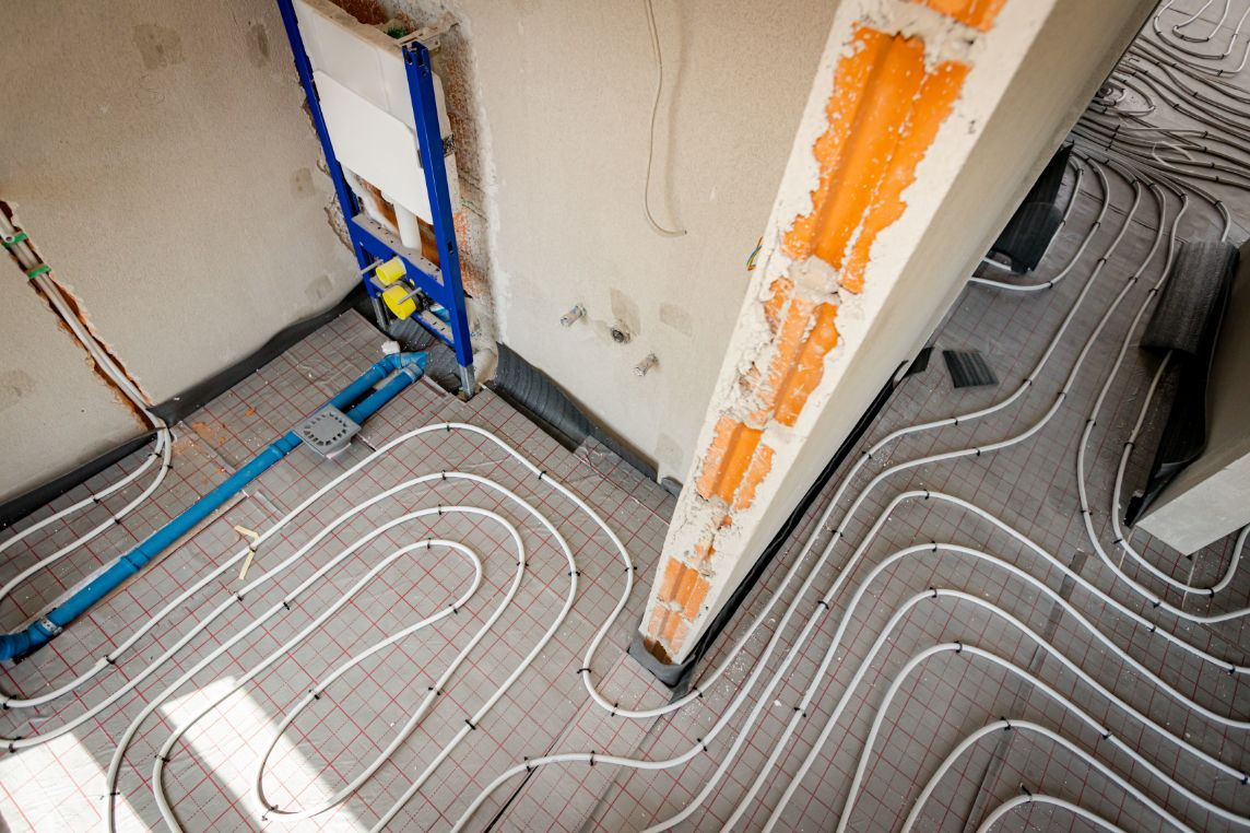 Floor Under Construction with White Tubing for Radiant Heat — Illawarra Underfloor Heating In Ulladulla, NSW