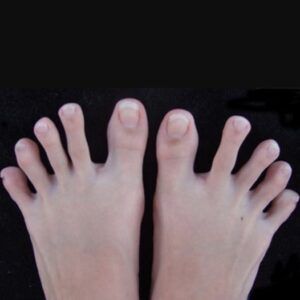 A close up of a person 's feet with a black background