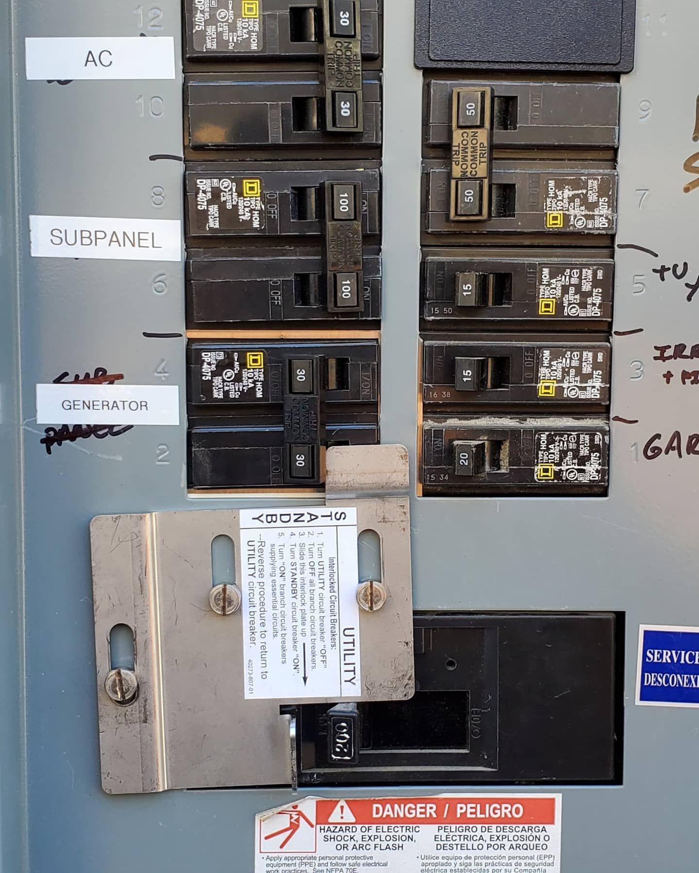Electrical breaker panel with labeled circuit breakers.