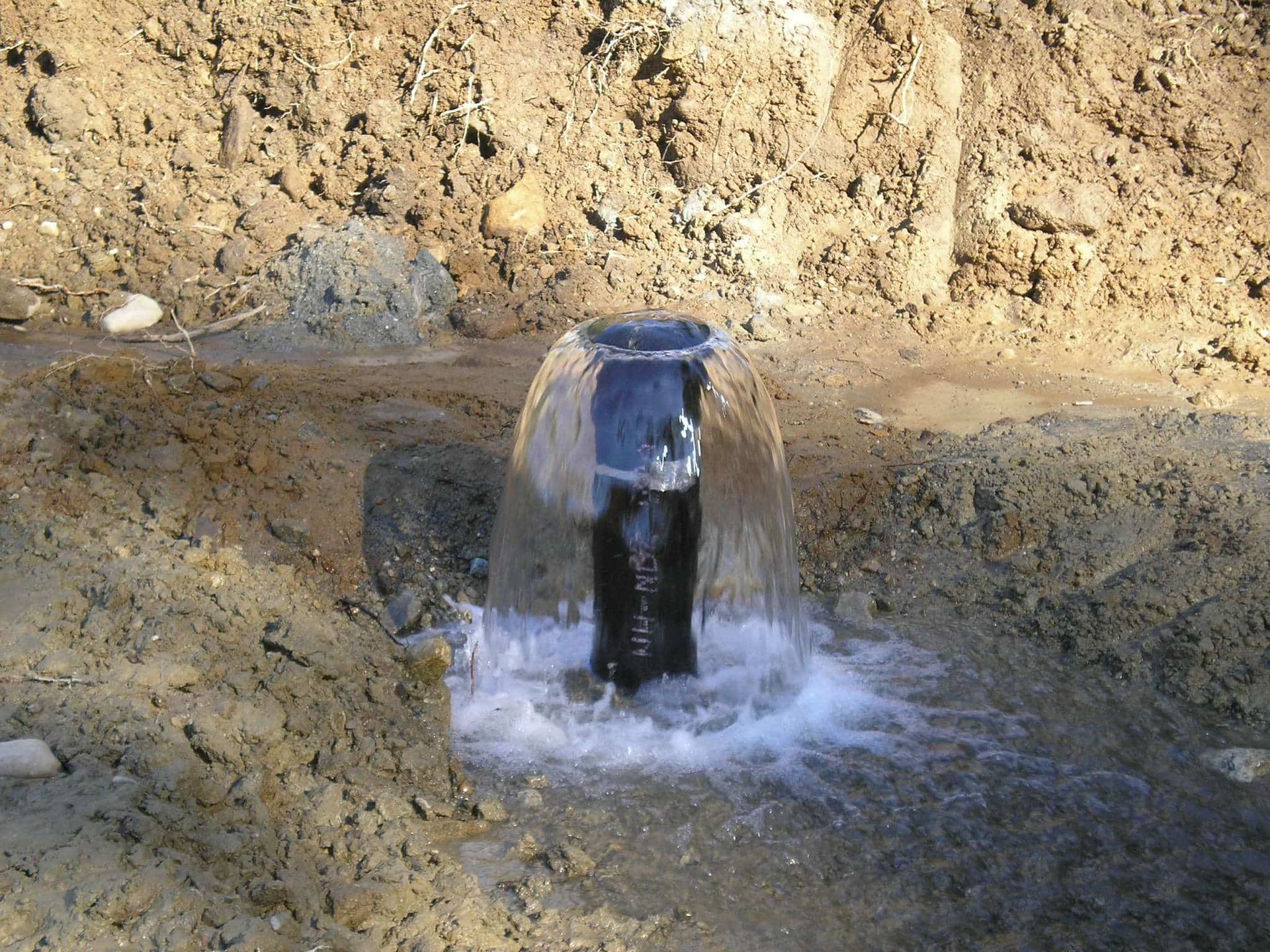 Water is coming out of a hole in the ground