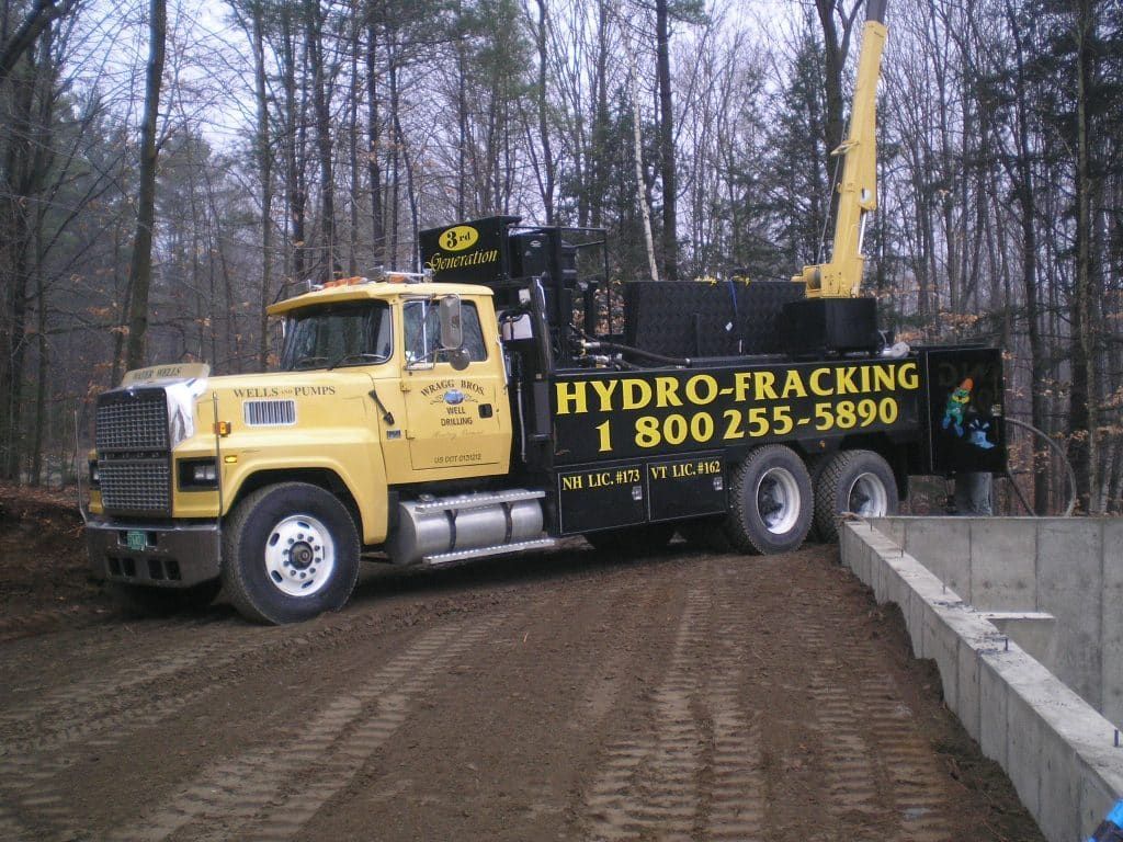 A yellow truck that says hydro-fracking on it from Wragg Brothers Well Drilling