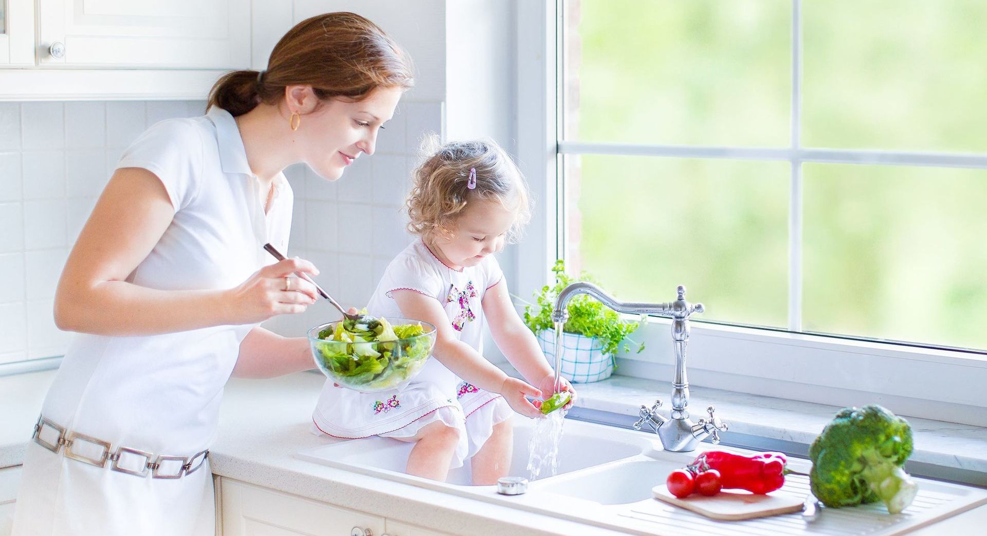 The Water Well Drilling Process: What Homeowners Need to Know
Mom with Child enjoying cleaning vegetables with flowing water in the kitchen sink