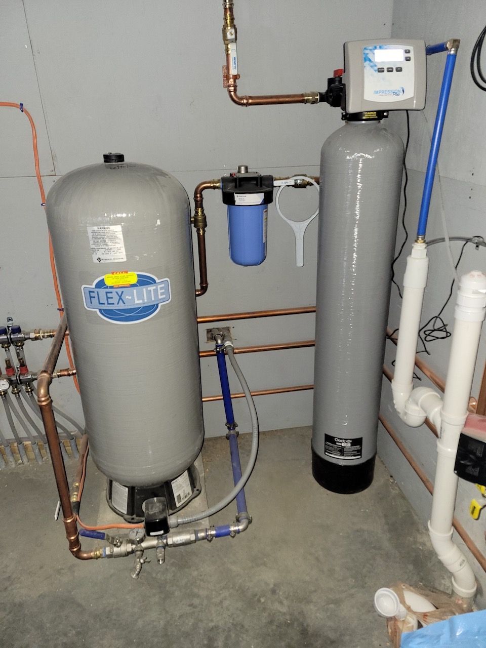 A flexlite water filtration system is installed in a basement