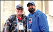 Bob White to Don Rodgers, a retired U.S. Navy chief petty officer pauses with his guardian for the Honor Flight mission, Bob White.