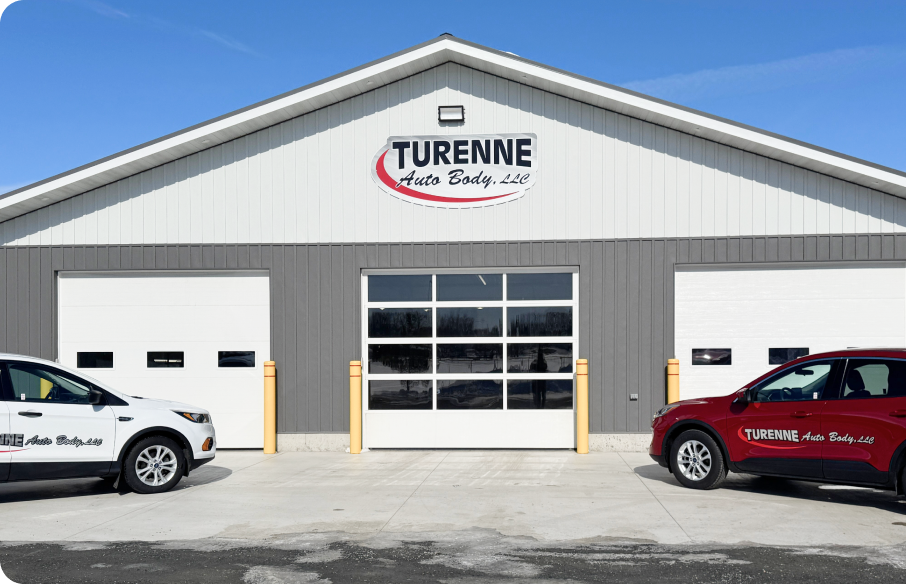 auto repair team standing in garage | Oscar's Automotive