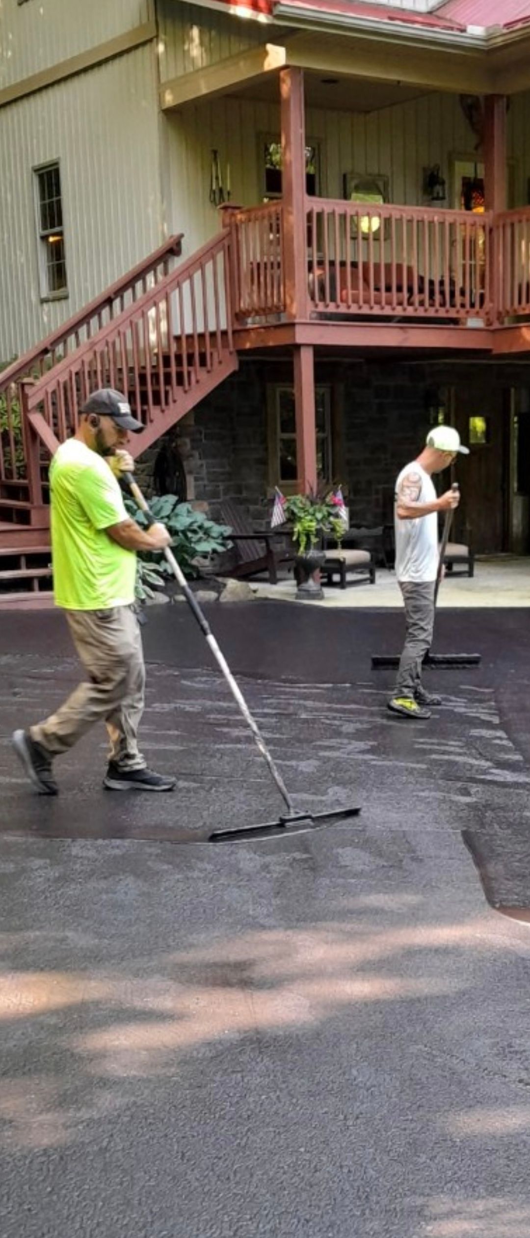 Two Men Sealcoating the Road