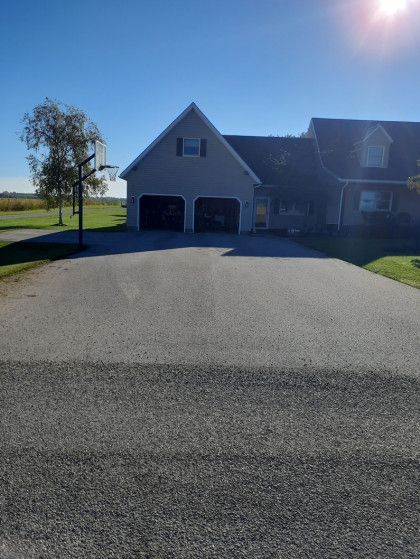 A house with a basketball hoop in front of it
