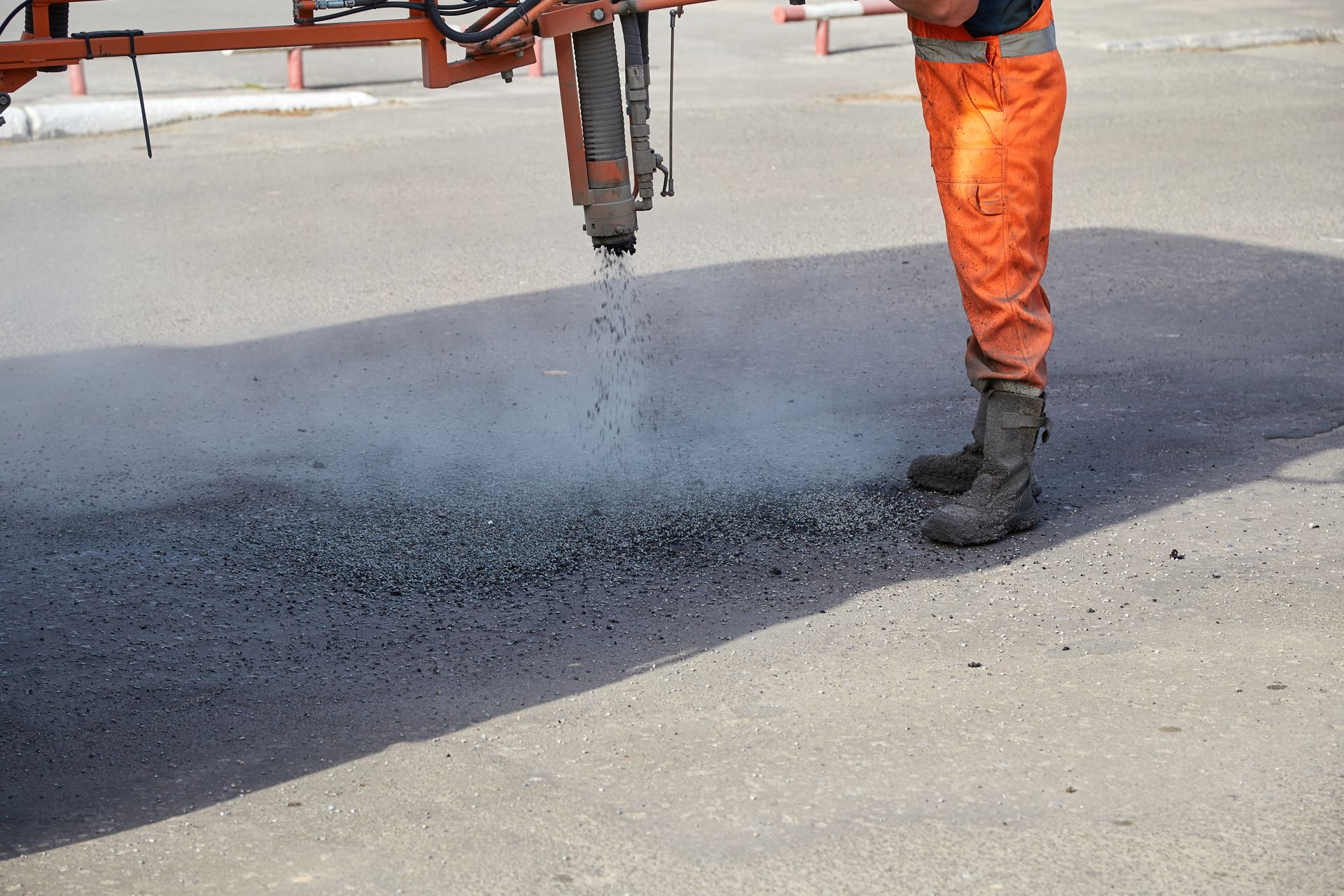 Pouring Hot Asphalt on the Road