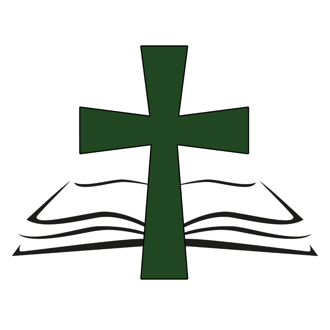 A green cross is sitting on top of an open book.