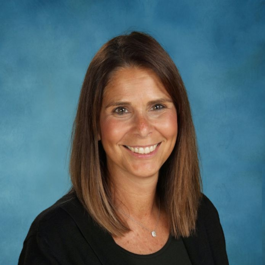 A woman wearing a lanyard with the word philip on it
