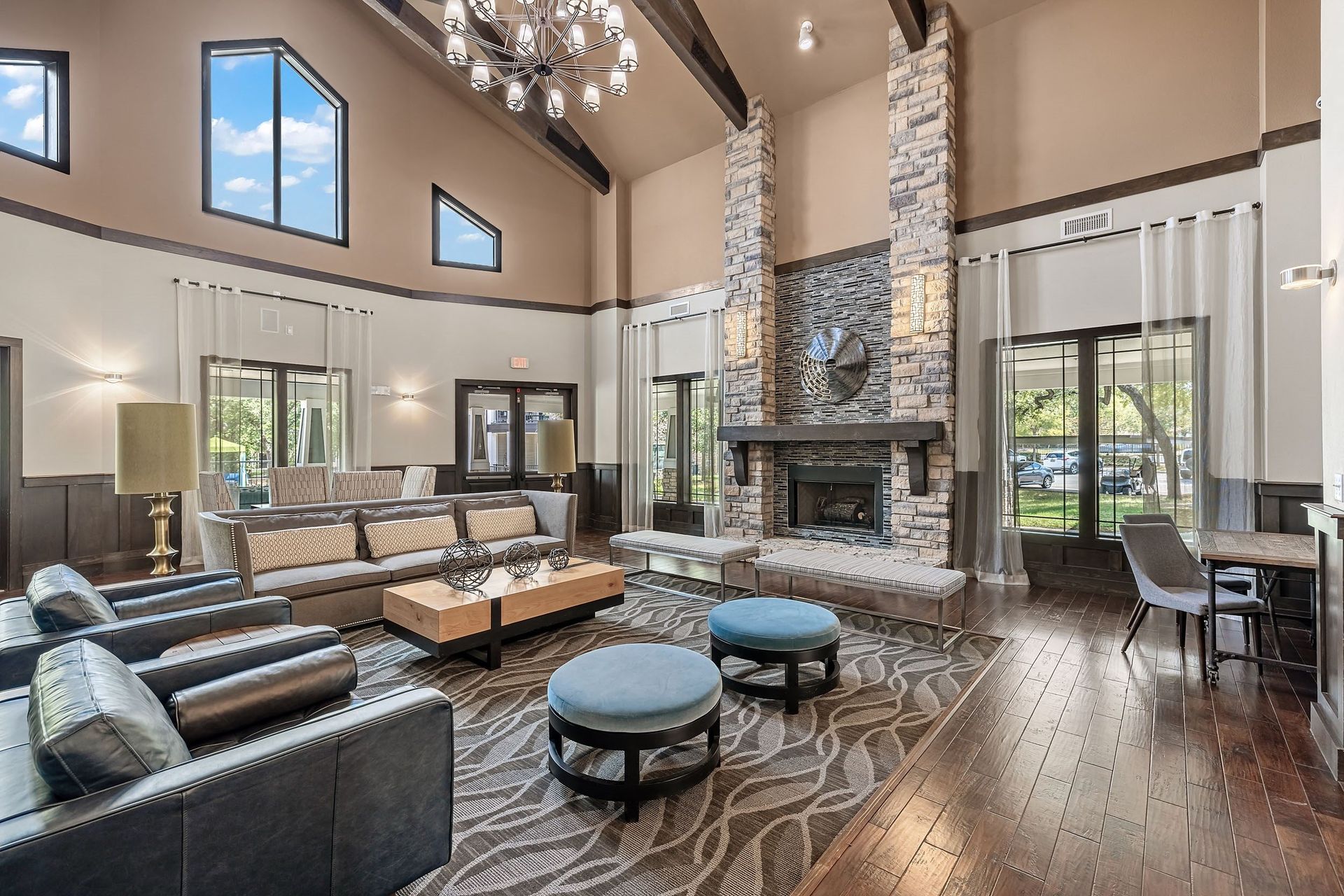 a large living room with couches and a fireplace