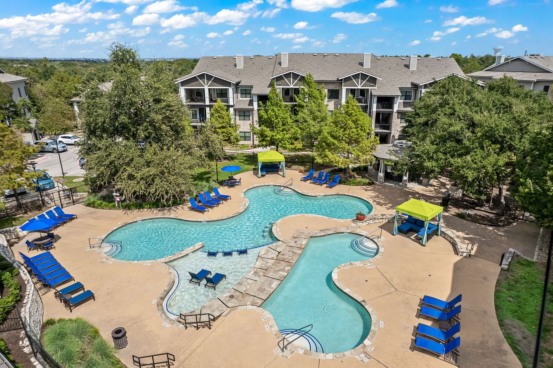 an aerial view of the resort style pool and lazy river