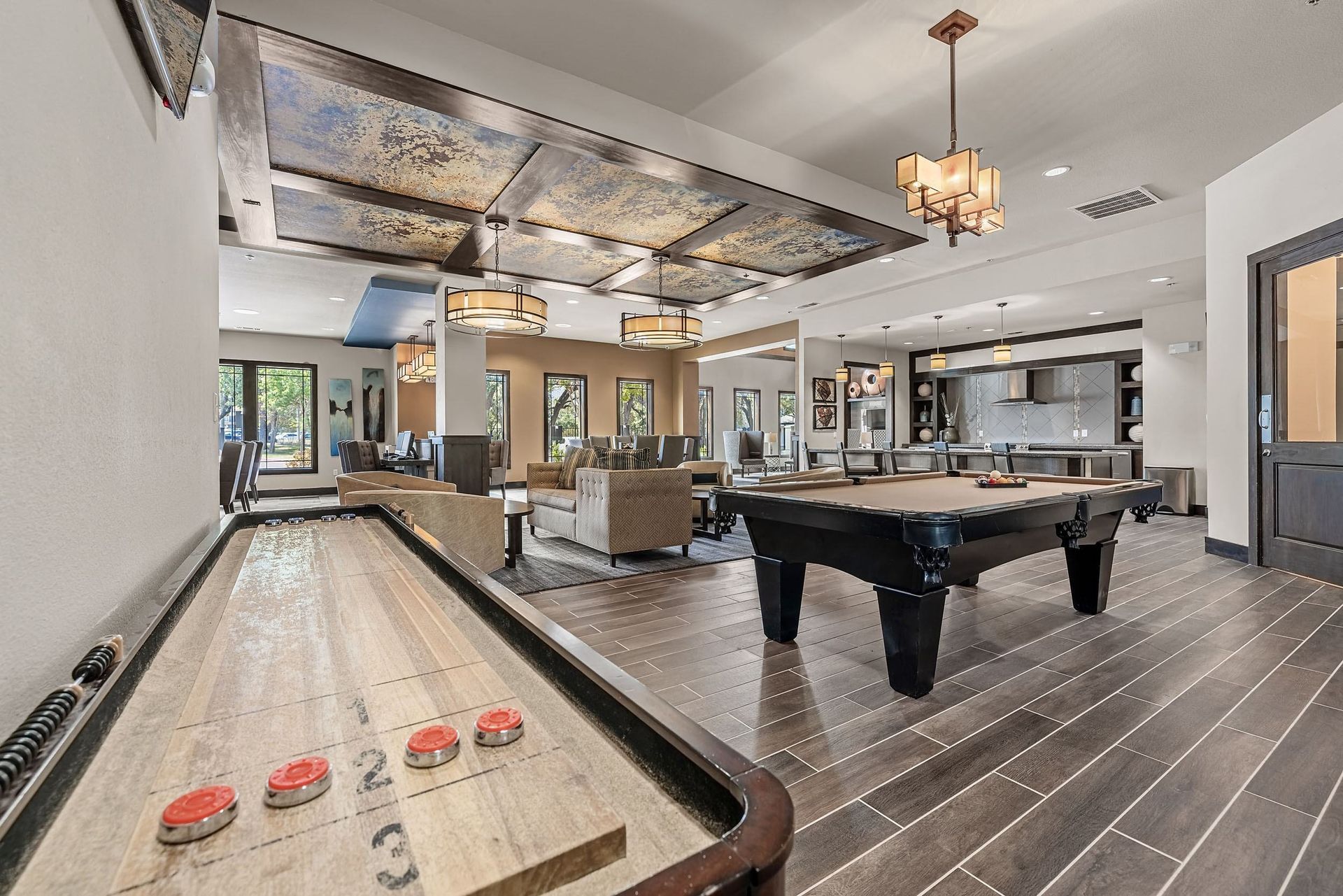 a game room with a pool table