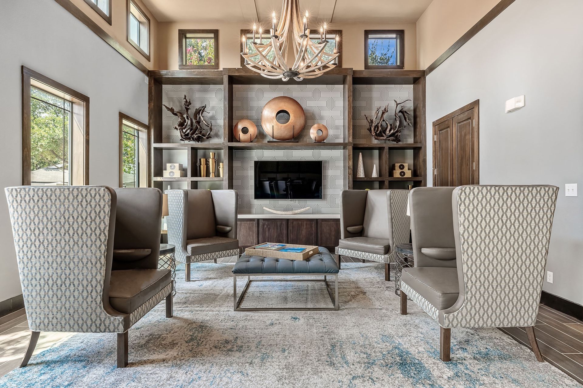 a living room with couches and chairs and a fireplace