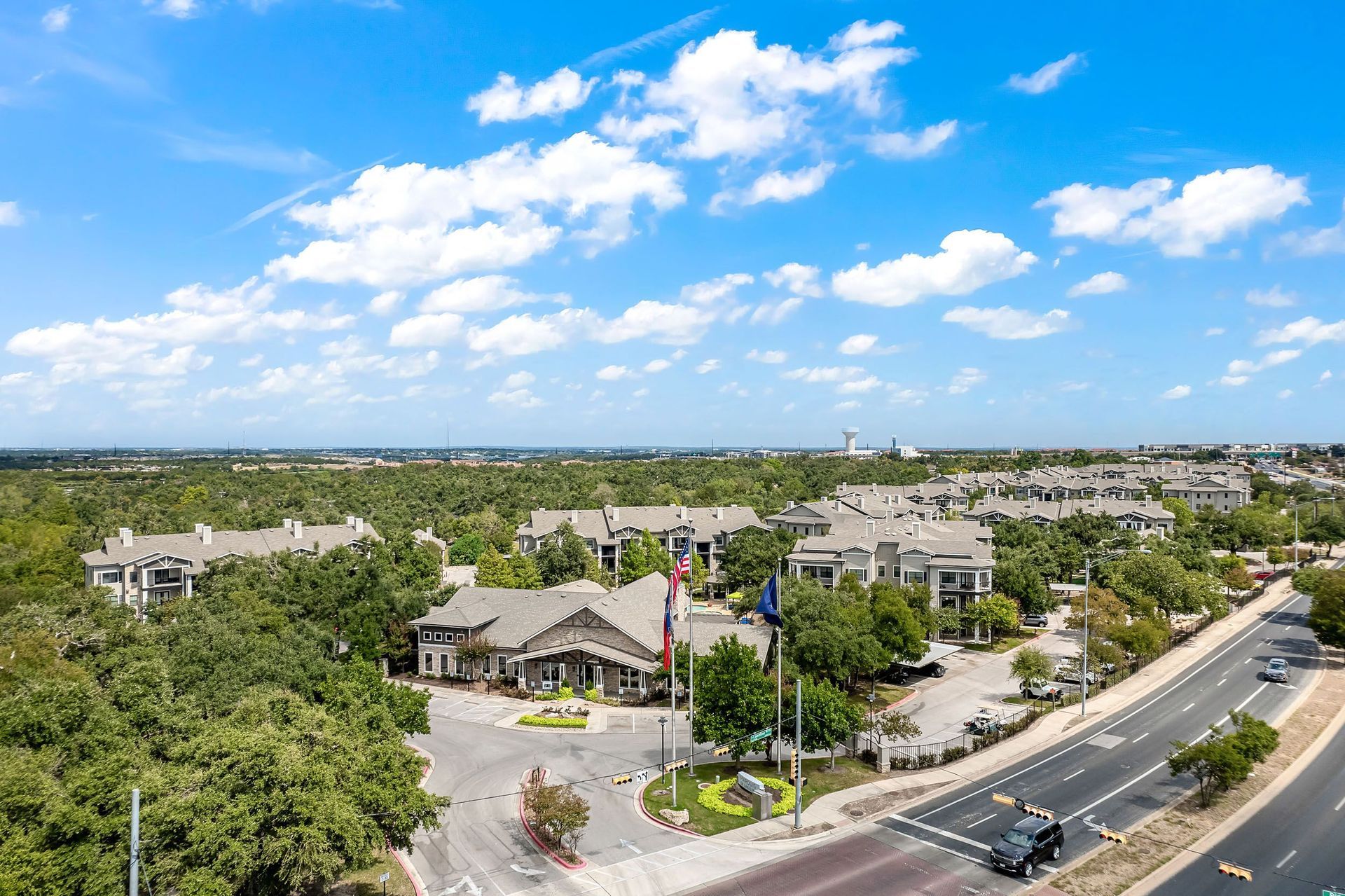 an aerial view of a neighborhood with houses and trees