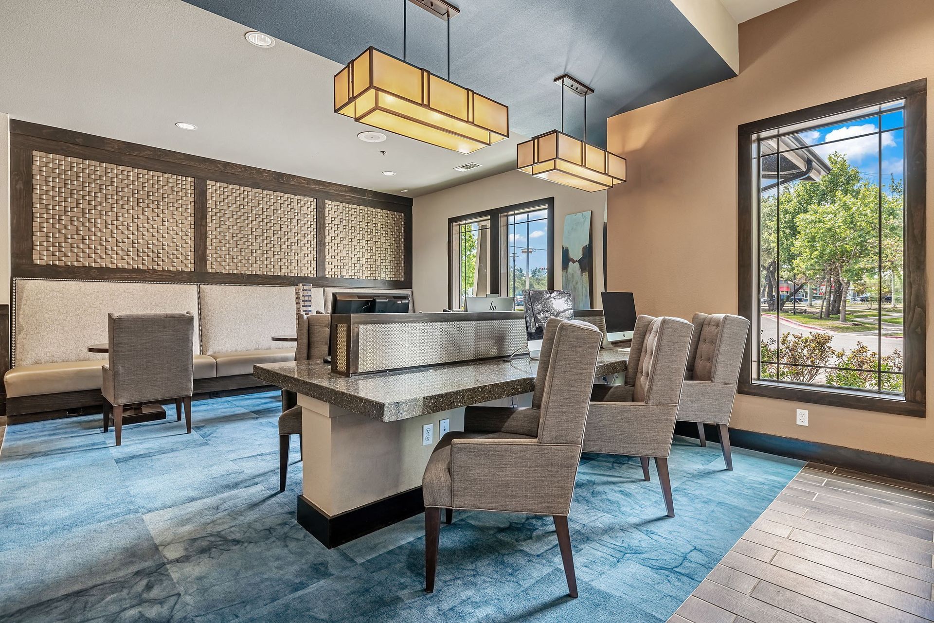 a clubhouse with a dining area with chairs and a table