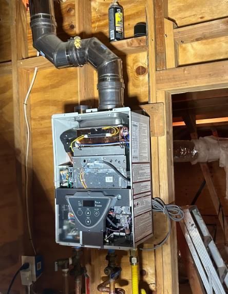 A water heater is hanging from the ceiling of a house