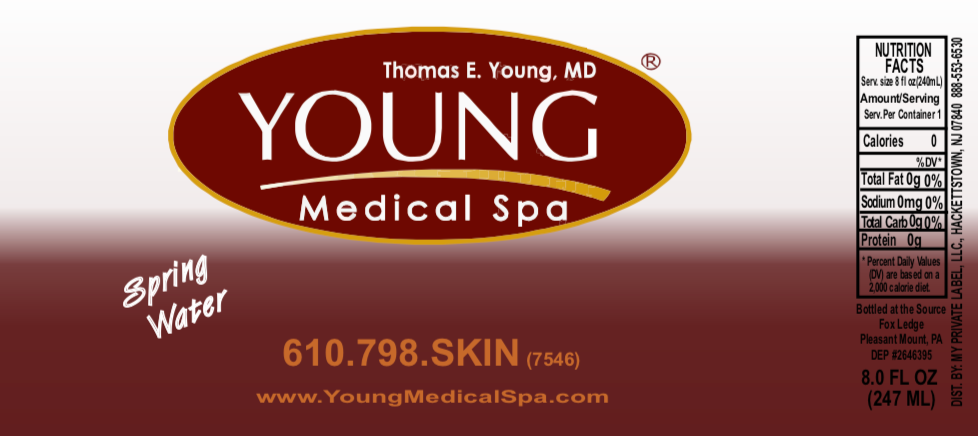 A bottle of young medical spa spring water