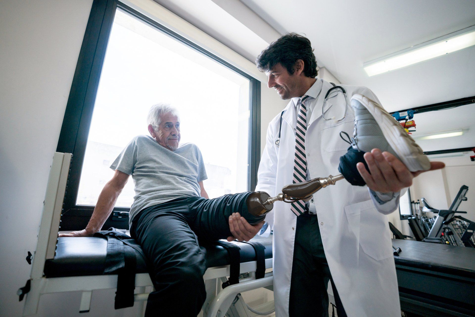 Prosthetists Checking The Prosthetic Leg Of His Client — Greenwood, SC — Carolina Prosthetics & Orthotics
