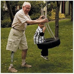 Old Man Playing With A Young Boy — Greenwood, SC — Carolina Prosthetics & Orthotics