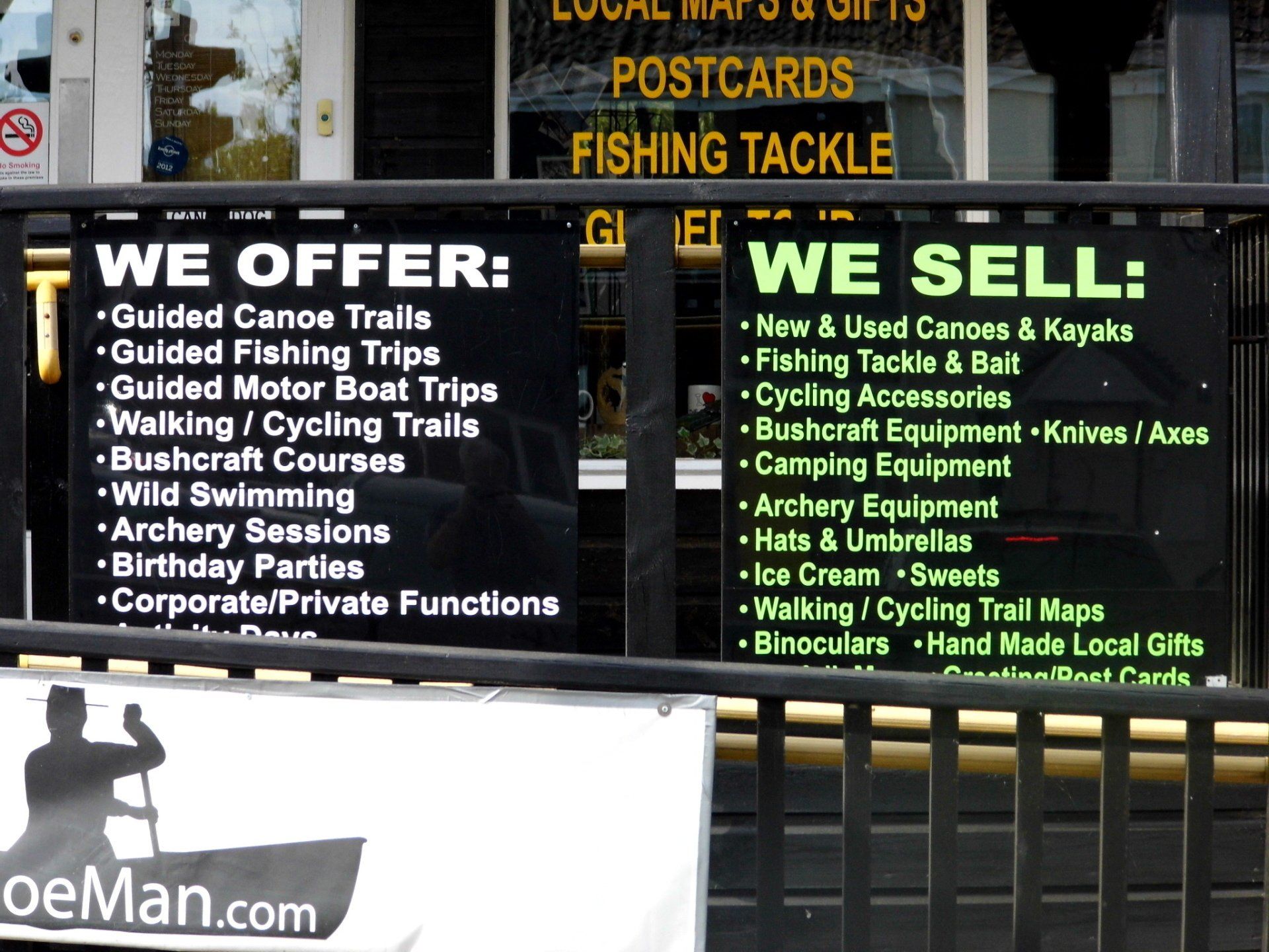 shop sign listing various organised  fishing and boating activities