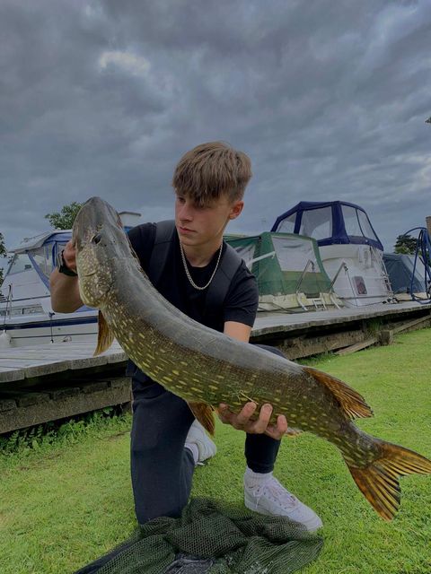 Teenager catches pike as big as him