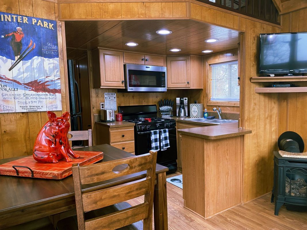 a small cabin with a porch and stairs