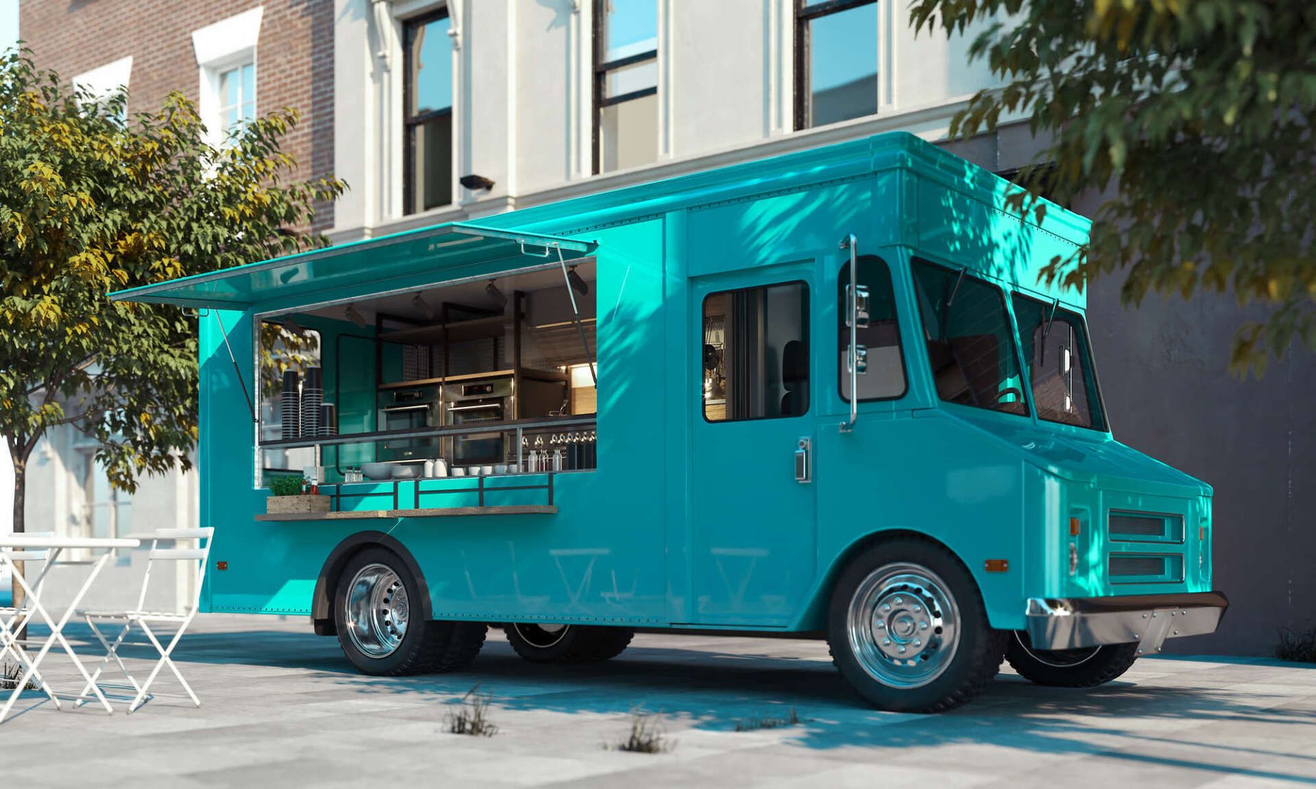 Turquoise food truck parked on a city street, serving food with open window.